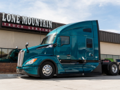 Aqua green 2027 Kenworth T680 parked outside Lone Mountain Truck Leasing's Carter Lake, Iowa headquarters.