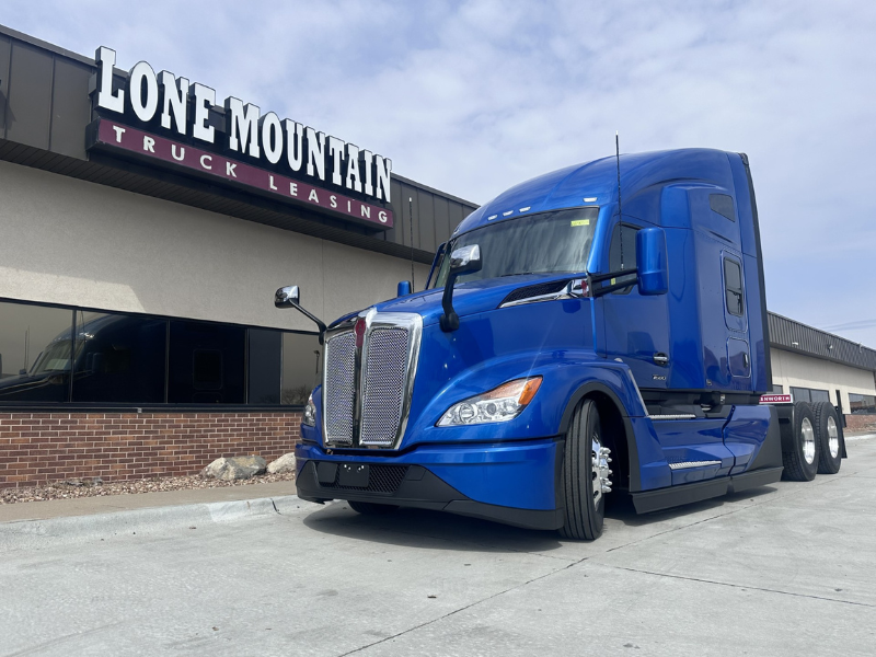Blue 2027 Kenworth T680 in front of the Lone Mountain Truck Leasing headquarters in Carter Lake, Iowa