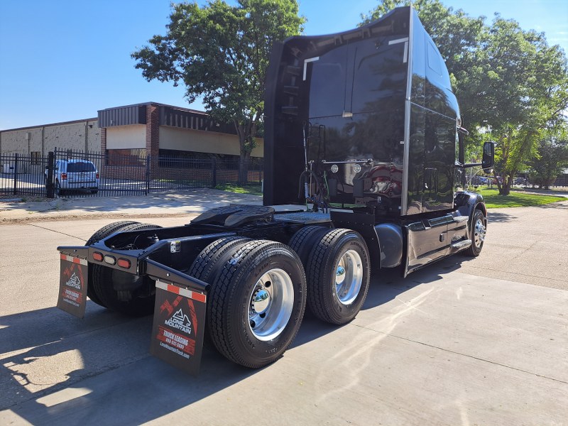 Passenger side and rear of 2022 Black Peterbilt 579