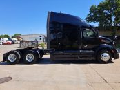 Passenger side of 2022 Black Peterbilt 579