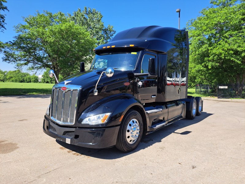 Front and driver's side of 2022 Black Peterbilt 579