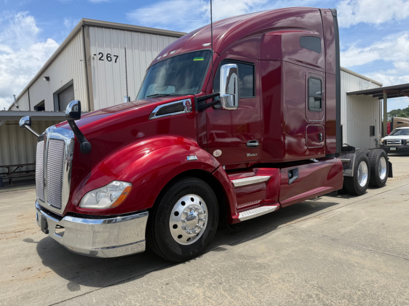 Driver's side and front of a maroon 2022 Kenworth T680