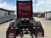 Rear of a maroon 2022 Kenworth T680