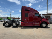 Passenger side of a maroon 2022 Kenworth T680