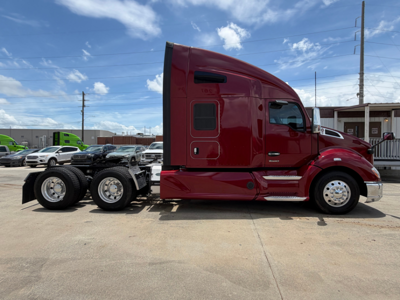 Passenger side of a maroon 2022 Kenworth T680