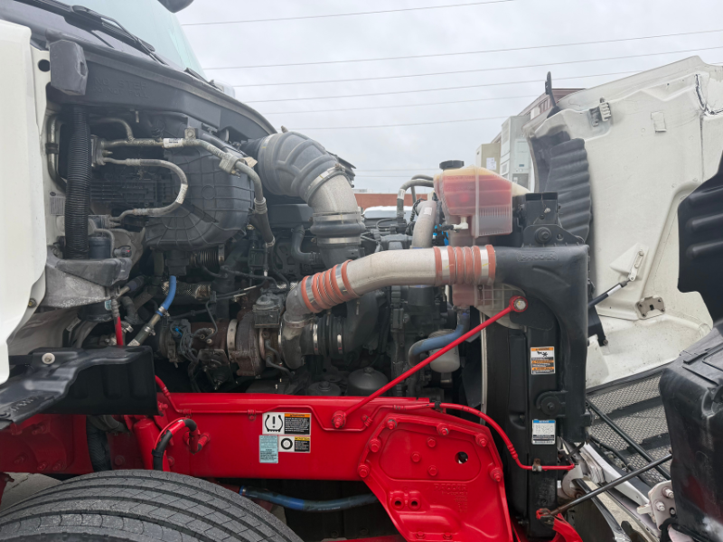Hood of a 2022 Peterbilt 579 semi truck up with engine and components visible