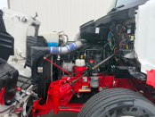Hood of a 2022 Peterbilt 579 semi truck up with engine and components visible