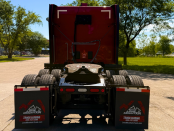 Back of a red 2022 Peterbilt 579 midroof