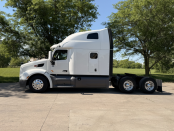 Driver side of a white 2022 Peterbilt 579