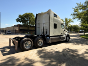 Passenger side and rear of a white 2022 Peterbilt 579