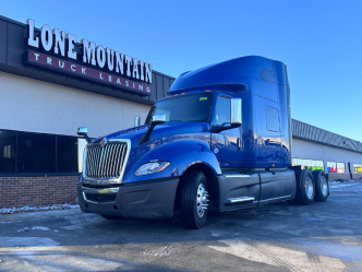 Blue 2022 International LT parked outside Lone Mountain Truck Leasing's corporate headquarters in Carter Lake, Iowa