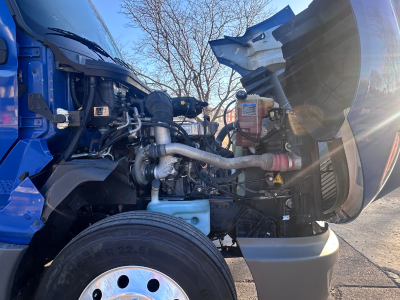 Hood of a blue 2022 International LT up with engine visible