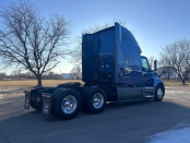 Passenger's side and rear of a blue 2022 International LT