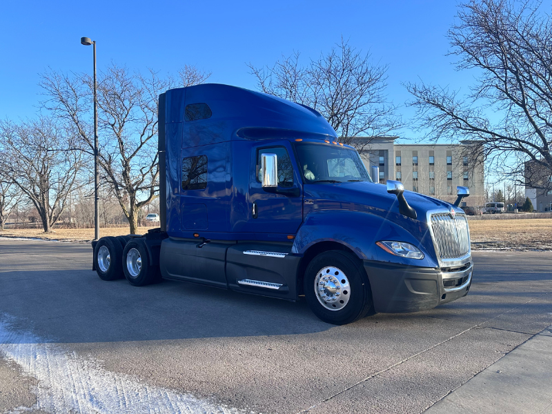 Passenger's side and front of a blue 2022 International LT