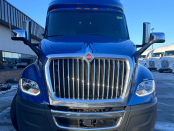 Closeup of front and grill of a blue 2022 International LT