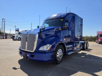 Blue 2022 Kenworth T680 front and driver side