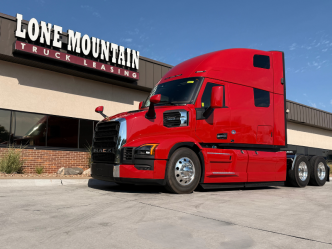 Red 2026 Mack Pioneer semi truck parked outside Lone Mountain Truck Leasing in Carter Lake, Iowa