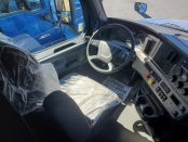Driver's side interior of a 2022 Freightliner Cascadia