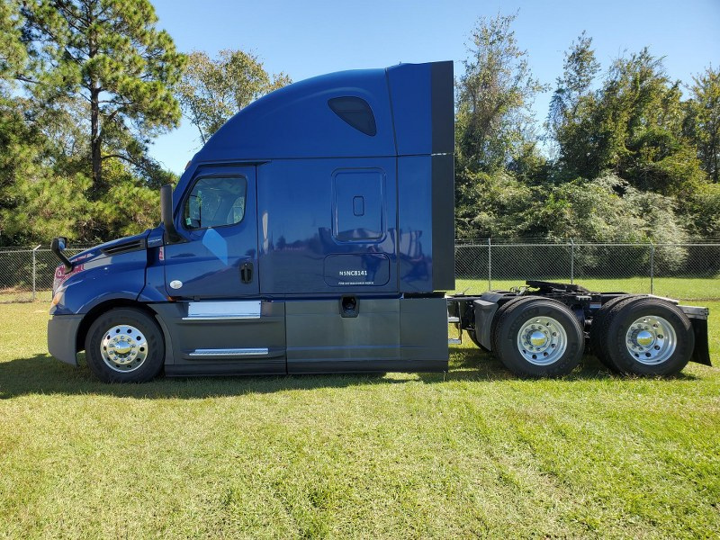 Driver's side of a blue 2022 Freightliner Cascadia