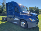 Passenger side front view of a blue 2022 Freightliner Cascadia