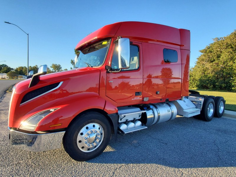Mid-roof red 2023 Volvo VNL 740 driver's side and front exterior
