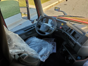 Driver's side interior of a 2023 Volvo VNL 740